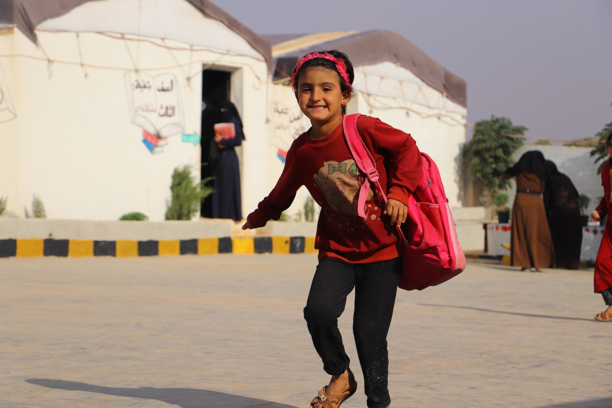 In pictures: No more classes in a tent. A new school brings Asma and her classmates in from the cold