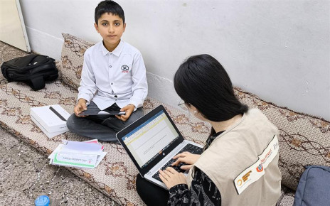 Eisa is in his room in Erbil Iraq, with PIN's staff playing PIN's environmental game after receiving the tablet 