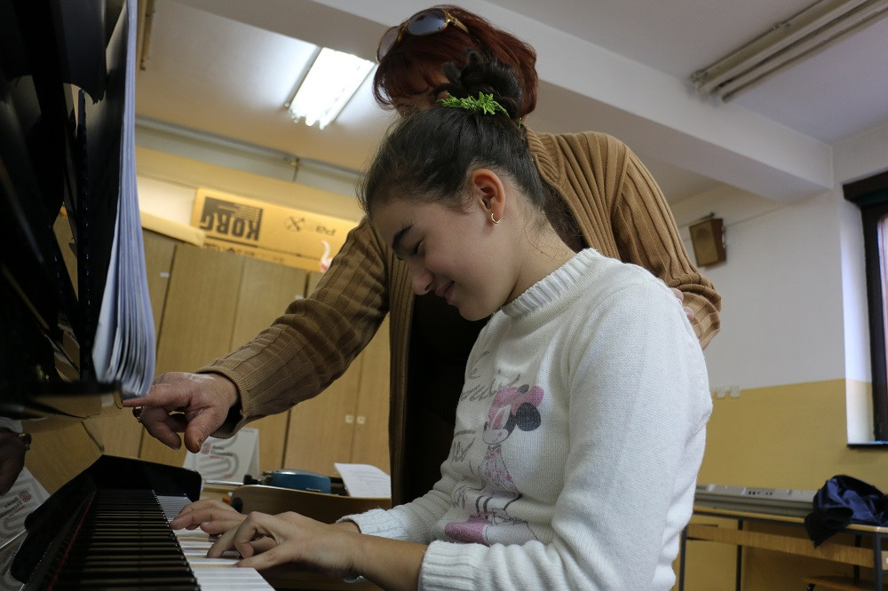 Alba is only student I can give the key to piano cabinet