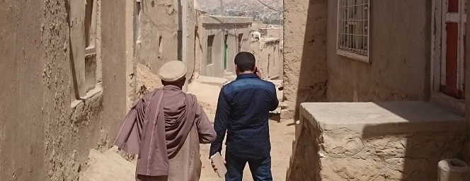 Afghan Safia ran out of her house, moments later it collapsed because of an earthquake. Her father is building a new one now